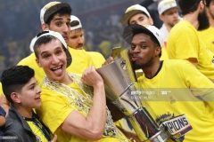 Fenerbahce's (from 2L) Bogdan Bogdanovic, Ahmet Duverioglu and Bobby Dixon pose with the trophy as they celebrate winning the first place basketball match between Fenerbahce and Olympiacos at the Euroleague Final Four basketball matches at Sinan Erdem Sport Arena, on May 21, 2017, in Istanbul.  / AFP PHOTO / Bulent Kilic        (Photo credit should read BULENT KILIC/AFP via Getty Images)